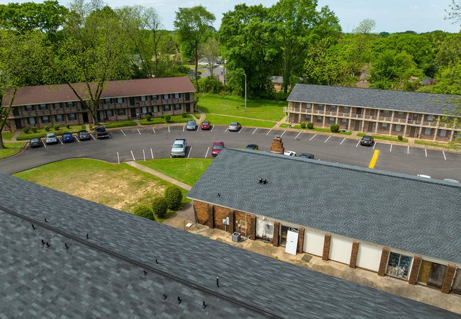 panoramic view of the parking lot at Woodlawn Manor, located in Tuscaloosa, AL